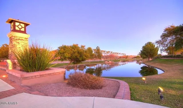 a view of swimming pool with a table and chairs