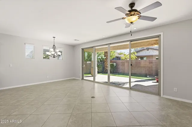 a large kitchen with granite countertop a stove a sink and a refrigerator