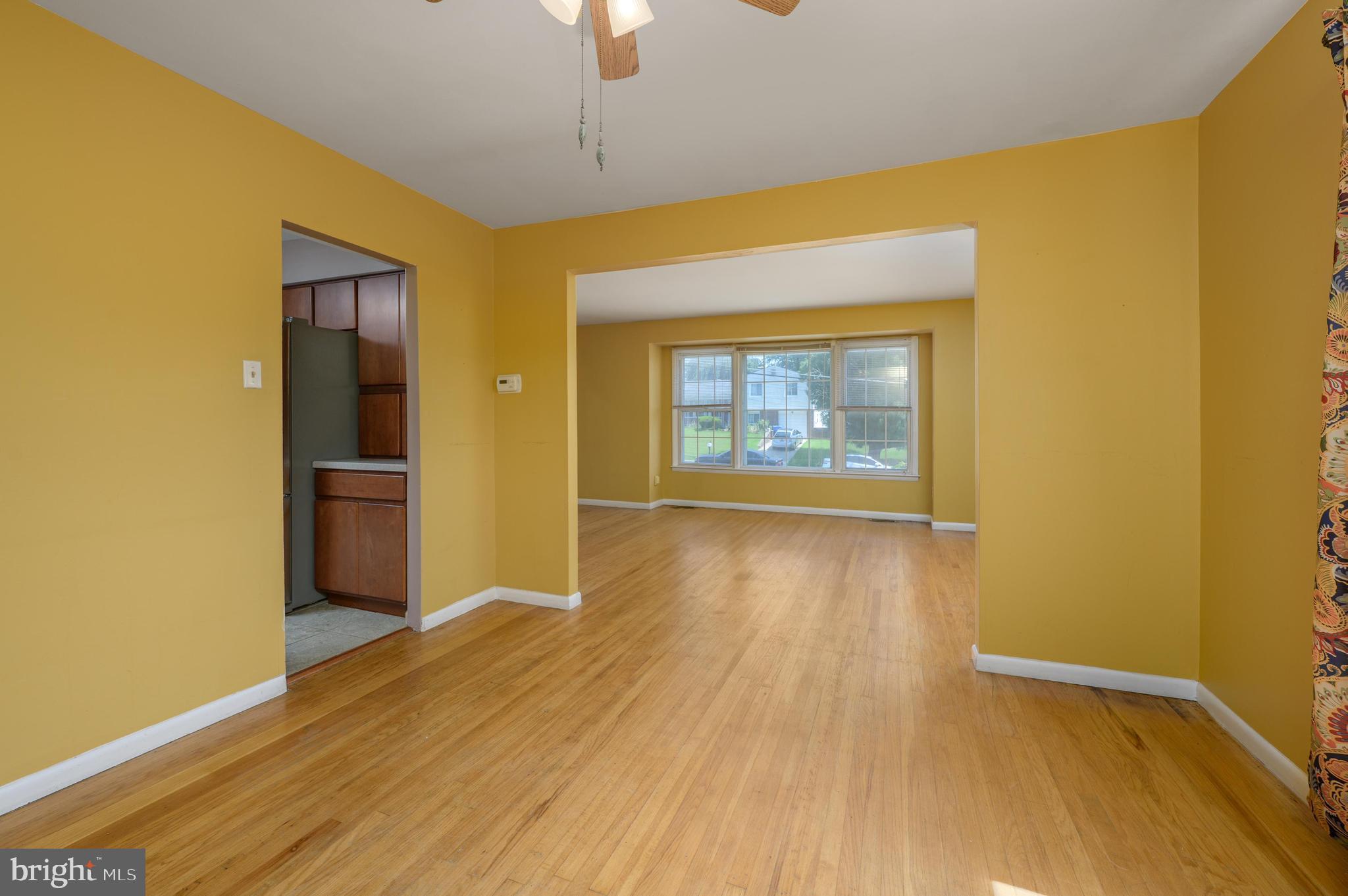 22 Clemson Road Cherry Hill, NJ 08034 - Photo 12 of 41 a view of an empty room with wooden floor and a window