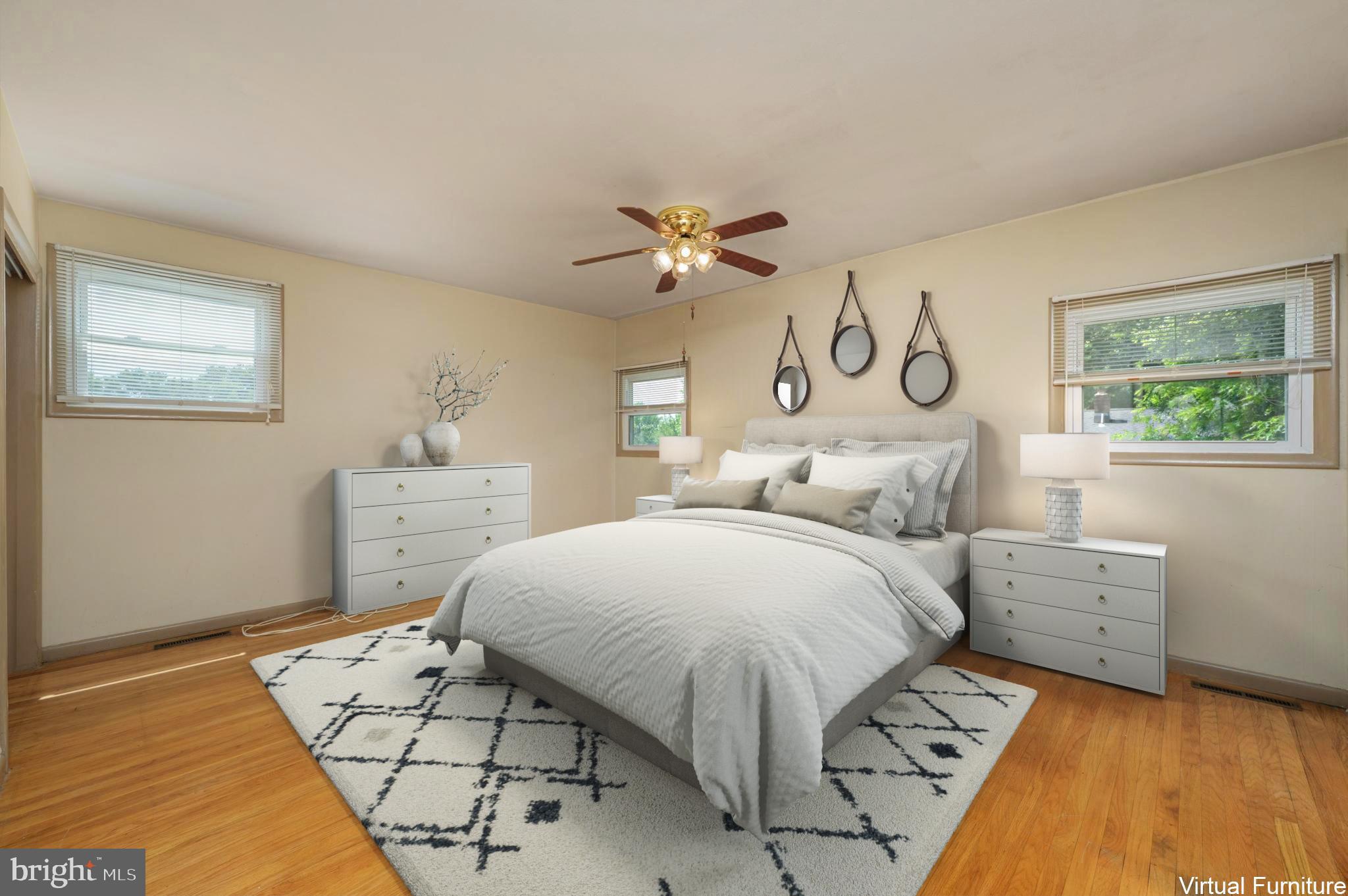 22 Clemson Road Cherry Hill, NJ 08034 - Photo 29 of 41 a spacious bedroom with a bed and a chandelier