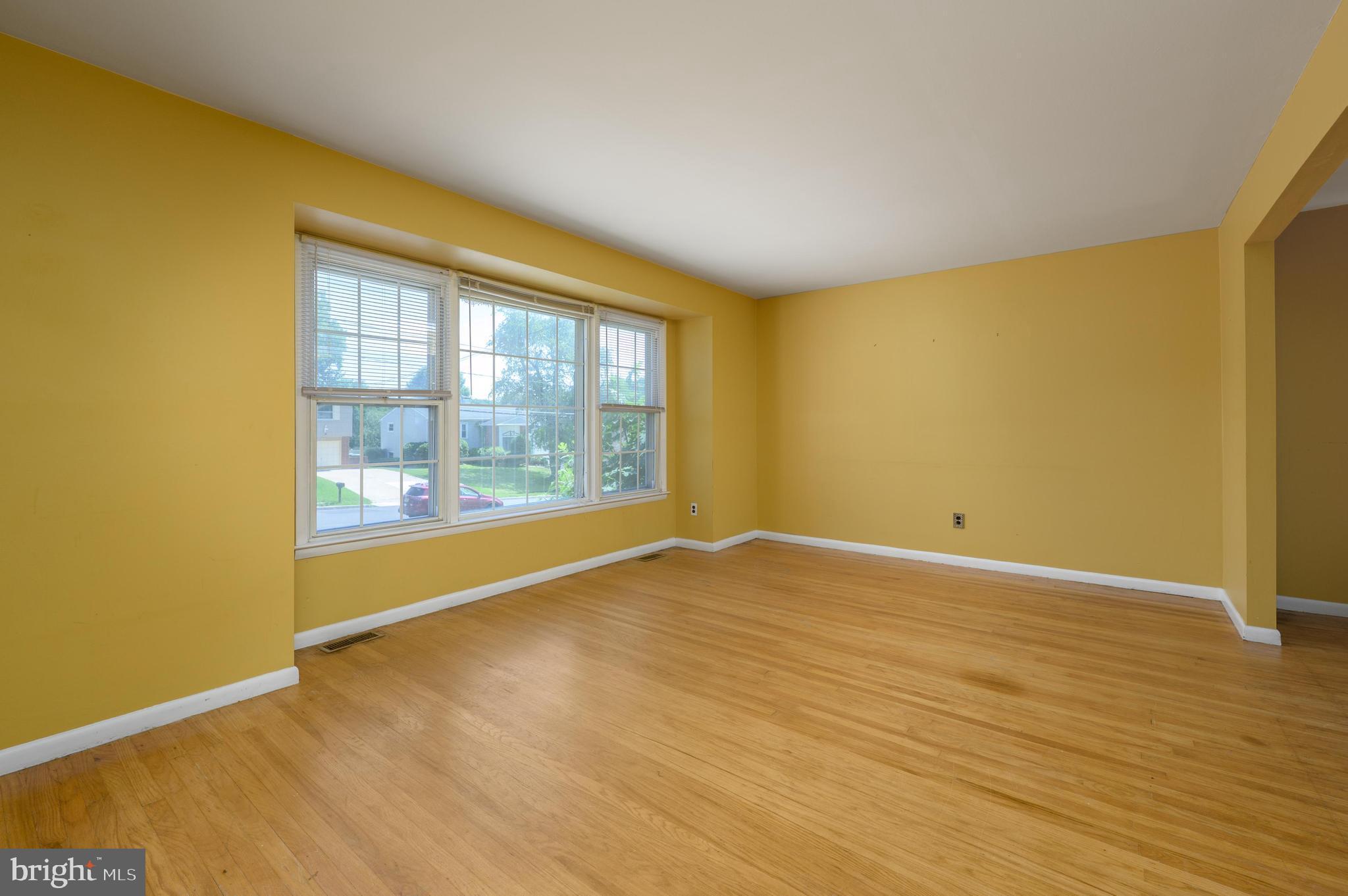 22 Clemson Road Cherry Hill, NJ 08034 - Photo 7 of 41 a view of an empty room with wooden floor and a window