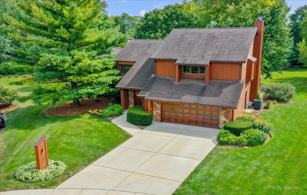 245 Perth Road Cary, IL 60013 - Photo 1 of 61 a aerial view of a house with a yard plants and large tree