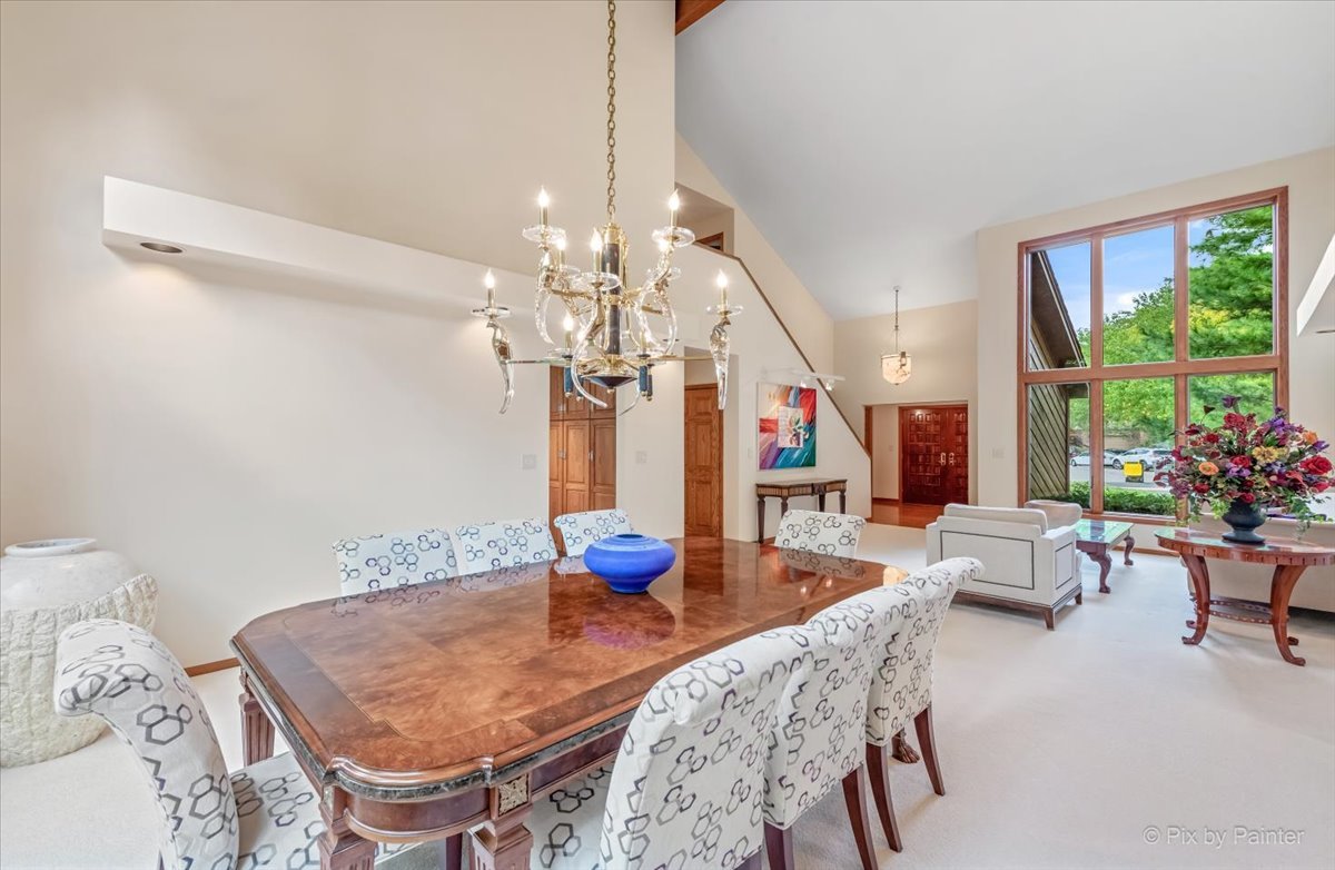 245 Perth Road Cary, IL 60013 - Photo 11 of 61 a view of a dining room with furniture a chandelier and wooden floor
