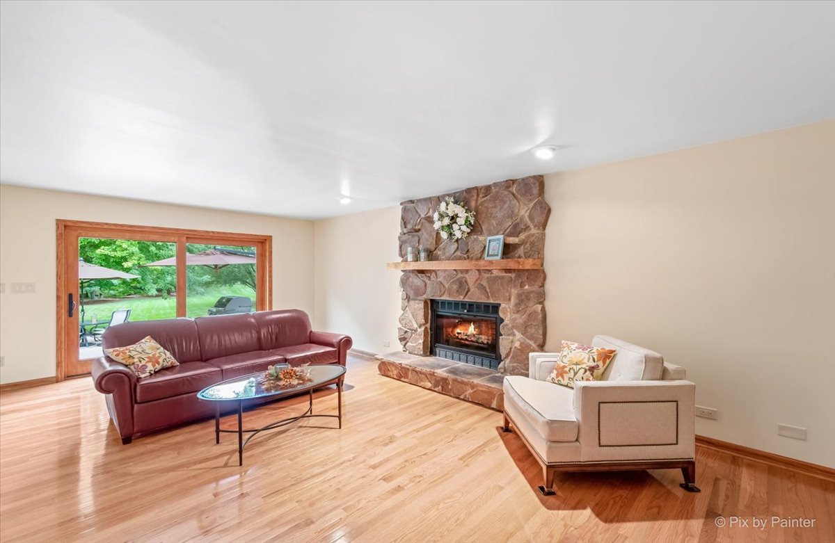 245 Perth Road Cary, IL 60013 - Photo 17 of 61 a living room with furniture and a fireplace