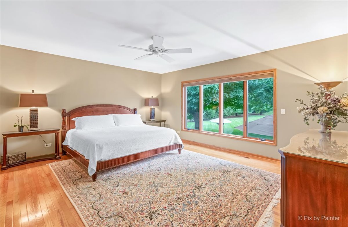 245 Perth Road Cary, IL 60013 - Photo 19 of 61 a bedroom with a large bed and a window