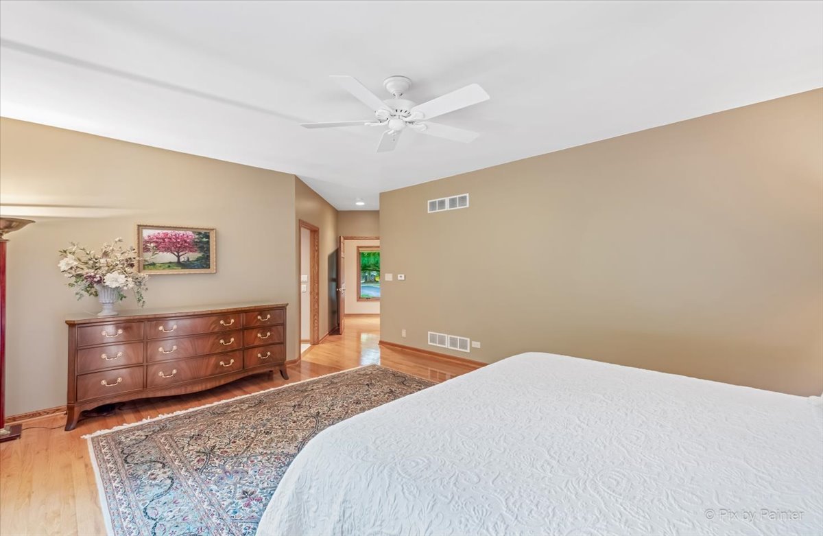 245 Perth Road Cary, IL 60013 - Photo 20 of 61 a bedroom with a bed dresser and a window