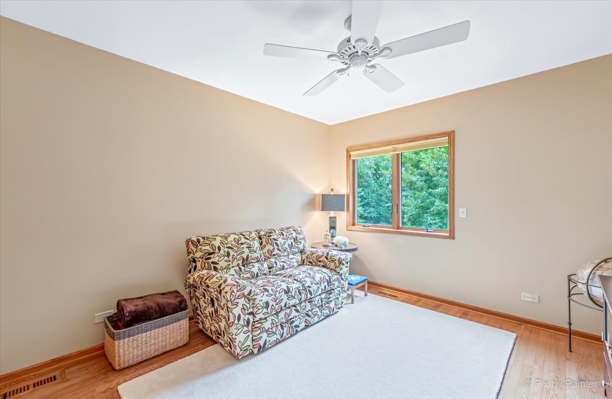 245 Perth Road Cary, IL 60013 - Photo 25 of 61 a bedroom with a bed and a couch