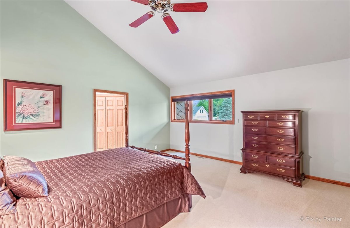 245 Perth Road Cary, IL 60013 - Photo 28 of 61 a bedroom with a bed and a dresser