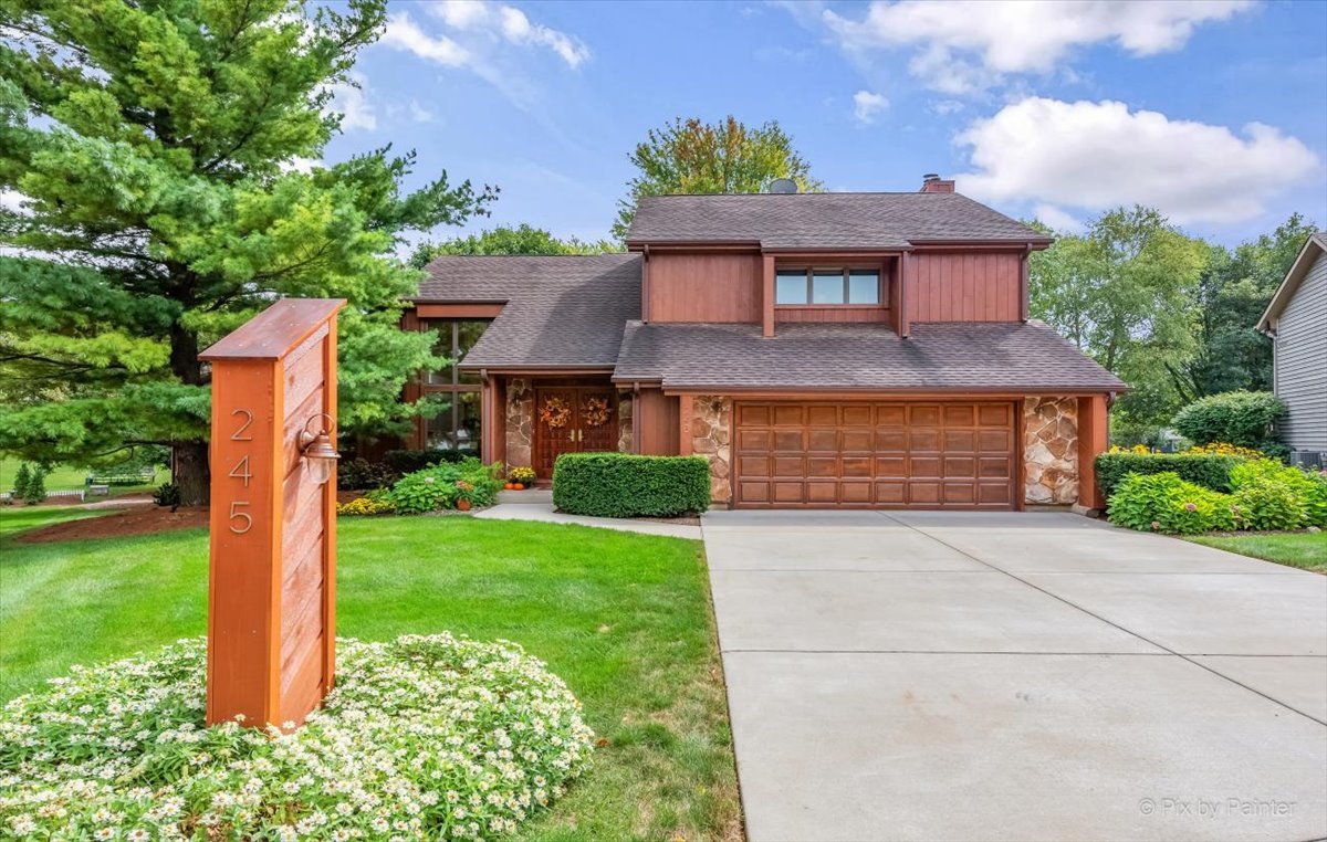 245 Perth Road Cary, IL 60013 - Photo 4 of 61 a front view of a house with garden