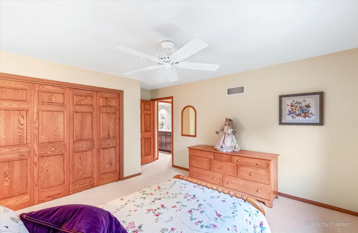 245 Perth Road Cary, IL 60013 - Photo 35 of 61 a bedroom with a bed and a dresser