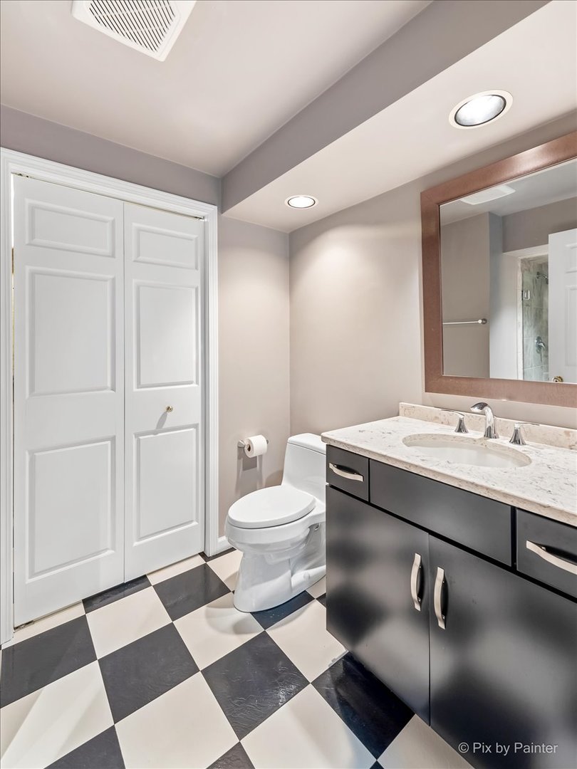245 Perth Road Cary, IL 60013 - Photo 44 of 61 a bathroom with a sink and a mirror