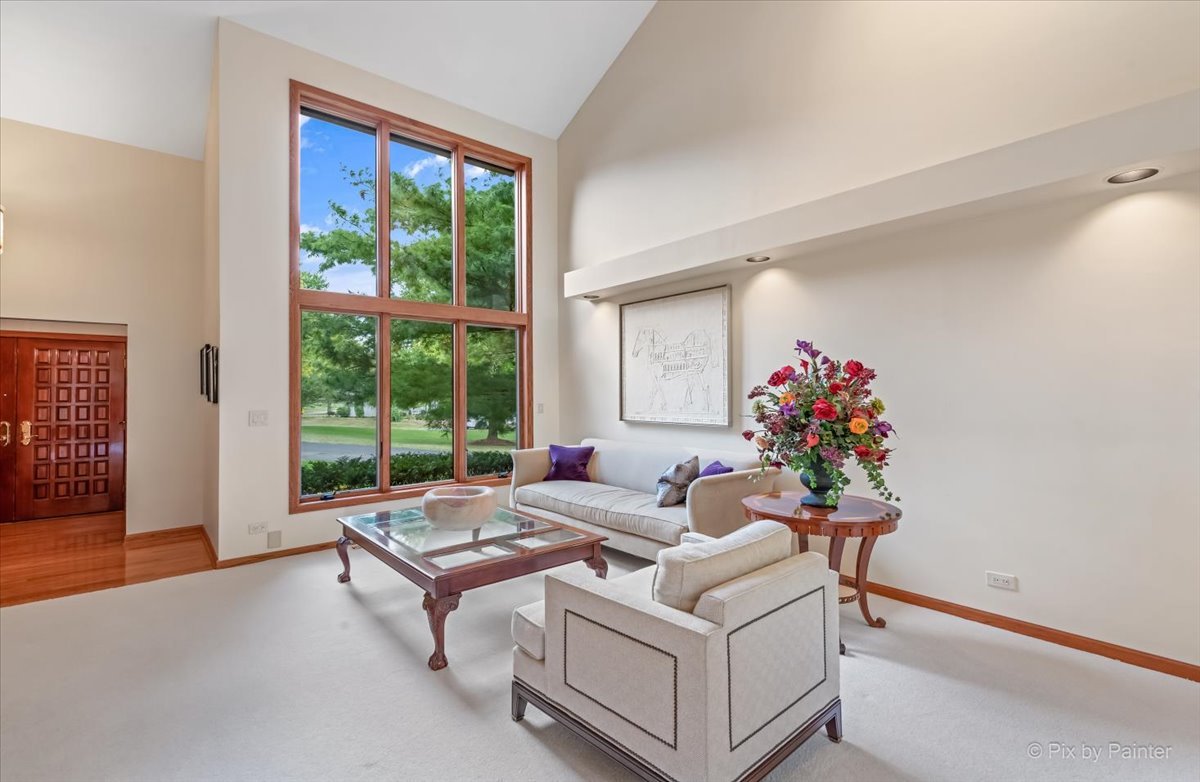 245 Perth Road Cary, IL 60013 - Photo 10 of 61 a living room with furniture and a large window