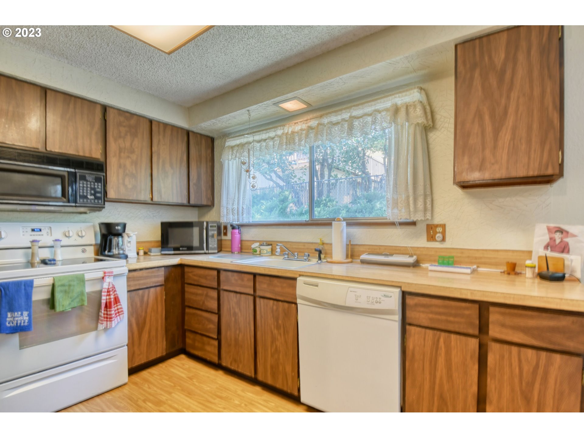 2108 Southwest Olson Avenue Pendleton, OR 97801 - Photo 18 of 47 a kitchen with a sink a window and cabinets