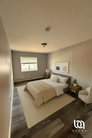 a bedroom with bed and window