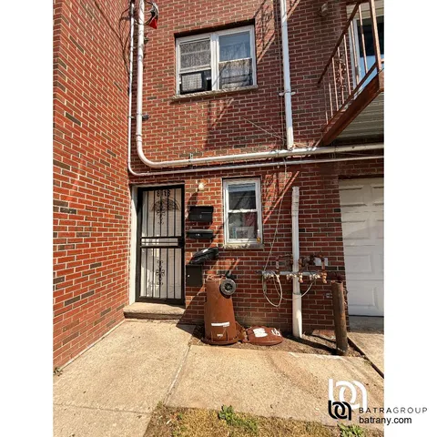 a view of a blue house with many windows