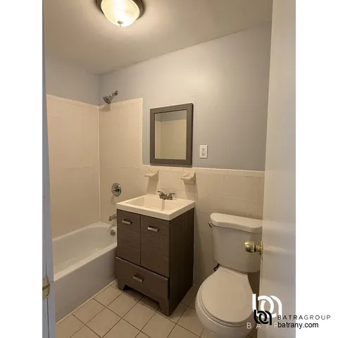 a bathroom with a sink a toilet and vanity