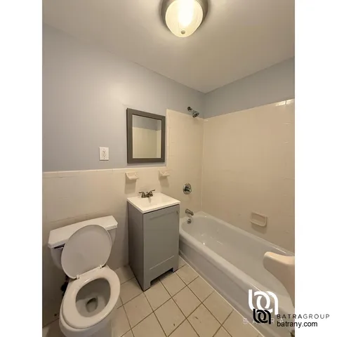 a bathroom with a toilet a sink and bathtub