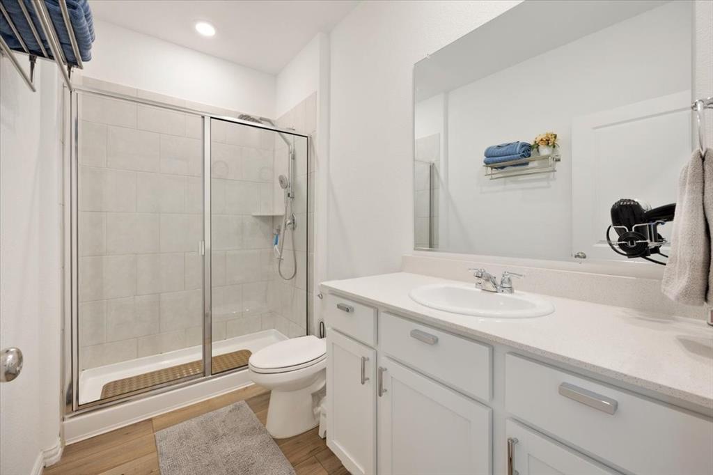 528 Poplar Street Princeton, TX 75407 - Photo 15 of 39 a bathroom with a sink a toilet and shower