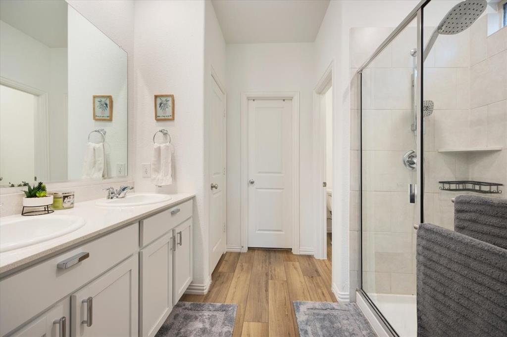 528 Poplar Street Princeton, TX 75407 - Photo 24 of 39 a bathroom with a sink and a mirror