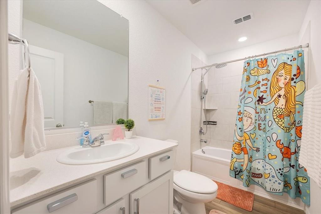 528 Poplar Street Princeton, TX 75407 - Photo 33 of 39 a bathroom with a sink toilet and shower