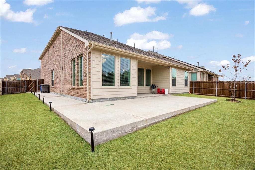 528 Poplar Street Princeton, TX 75407 - Photo 37 of 39 a view of a house with backyard and porch