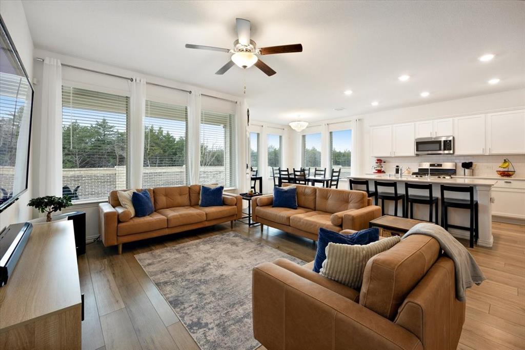 528 Poplar Street Princeton, TX 75407 - Photo 5 of 39 a living room with furniture kitchen view and a large window