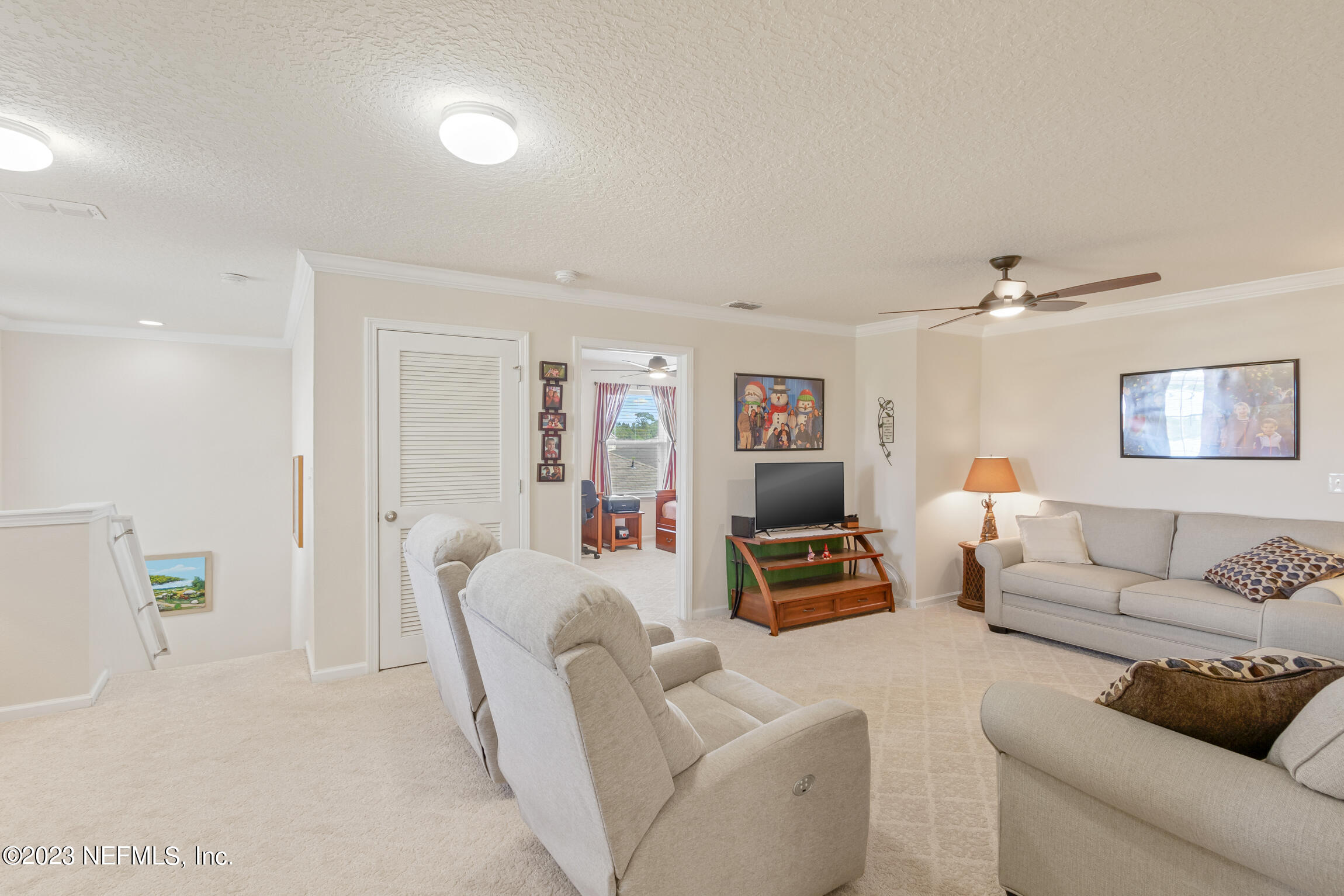 57 Deer Crossing Road St. Augustine, FL 32086 - Photo 33 of 48 a living room with furniture and a couch