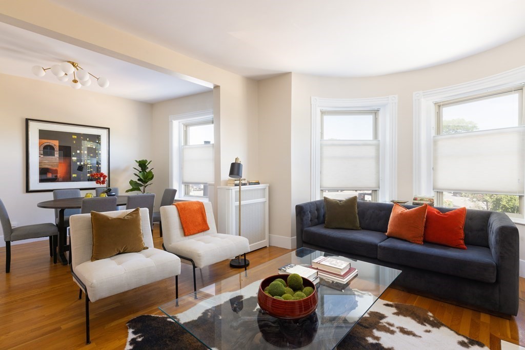 152 Harvard Street, Unit 4 Brookline, MA 02446 - Photo 1 of 26 a living room with furniture and a couch