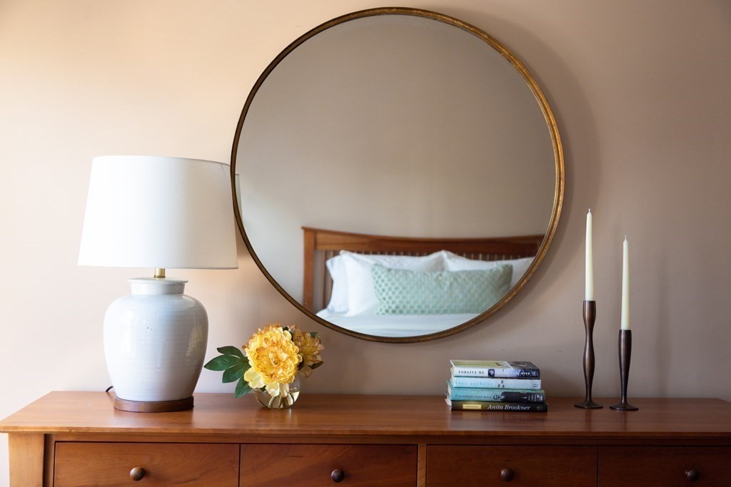 152 Harvard Street, Unit 4 Brookline, MA 02446 - Photo 11 of 26 a view of a mirror on a table and chair