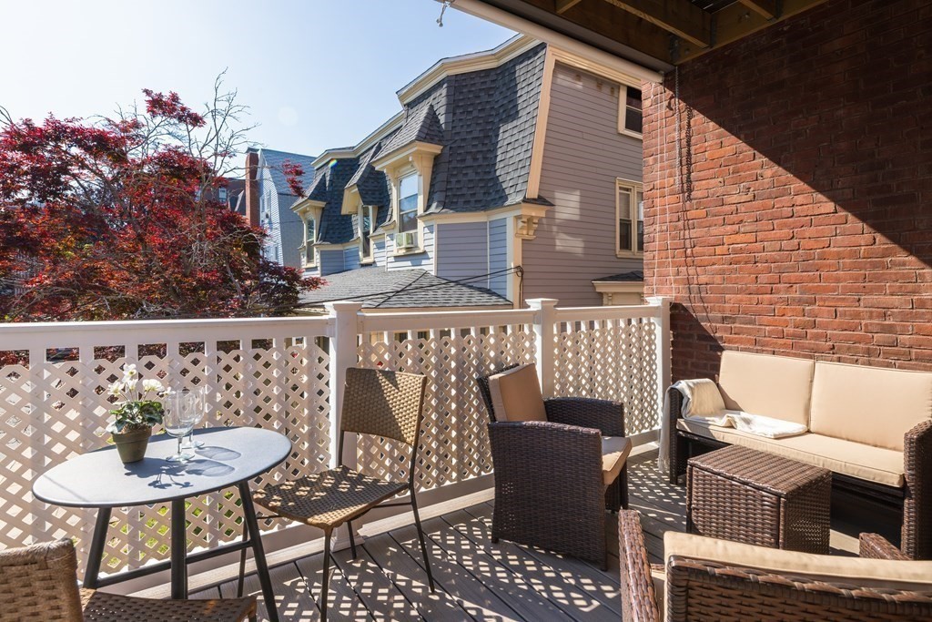152 Harvard Street, Unit 4 Brookline, MA 02446 - Photo 16 of 26 a view of a chairs and table in the balcony