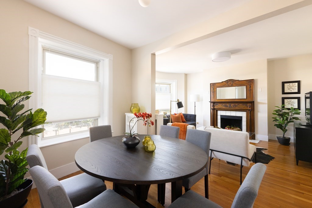 152 Harvard Street, Unit 4 Brookline, MA 02446 - Photo 4 of 26 a view of a dining room with furniture window and wooden floor