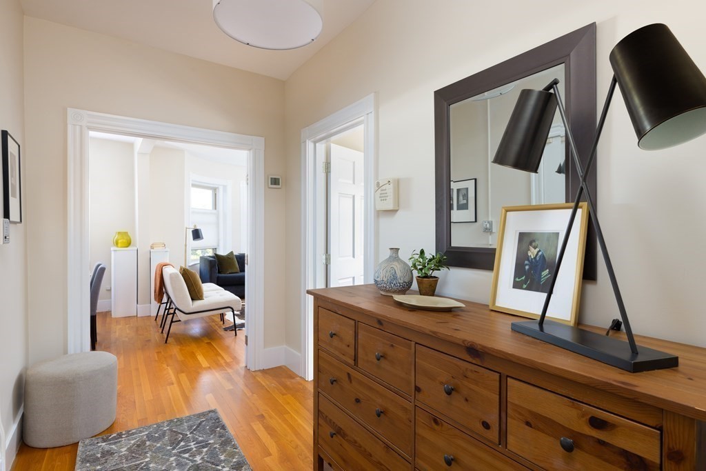 152 Harvard Street, Unit 4 Brookline, MA 02446 - Photo 6 of 26 a view of living room with furniture and wooden floor