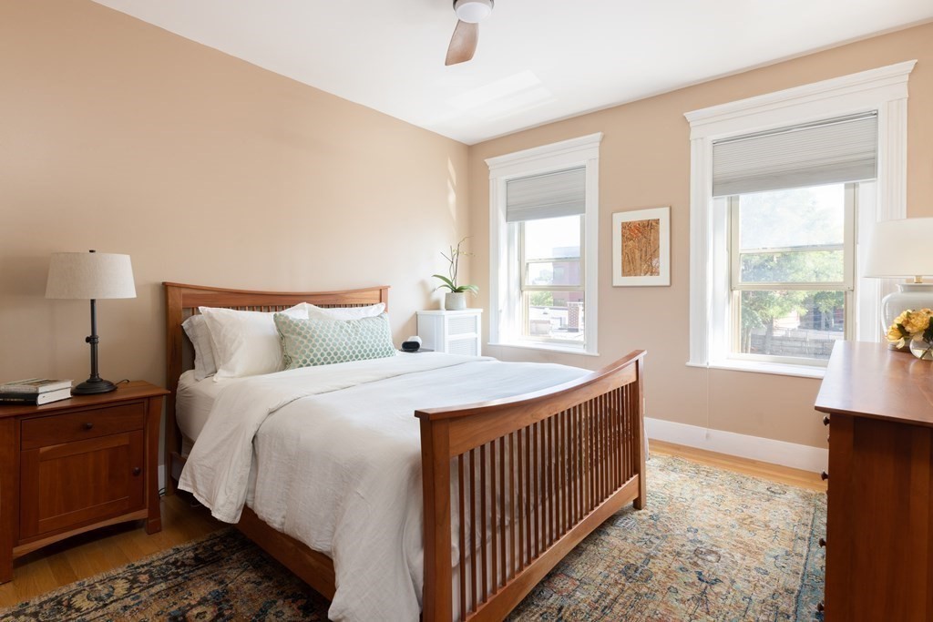152 Harvard Street, Unit 4 Brookline, MA 02446 - Photo 9 of 26 a bedroom with bed and a window