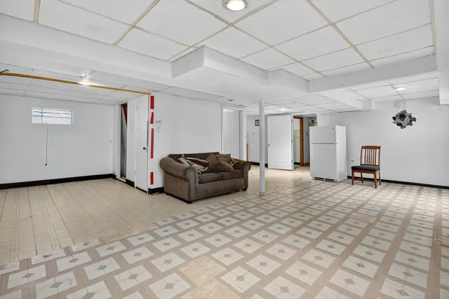 a view of a livingroom with a couch and furniture