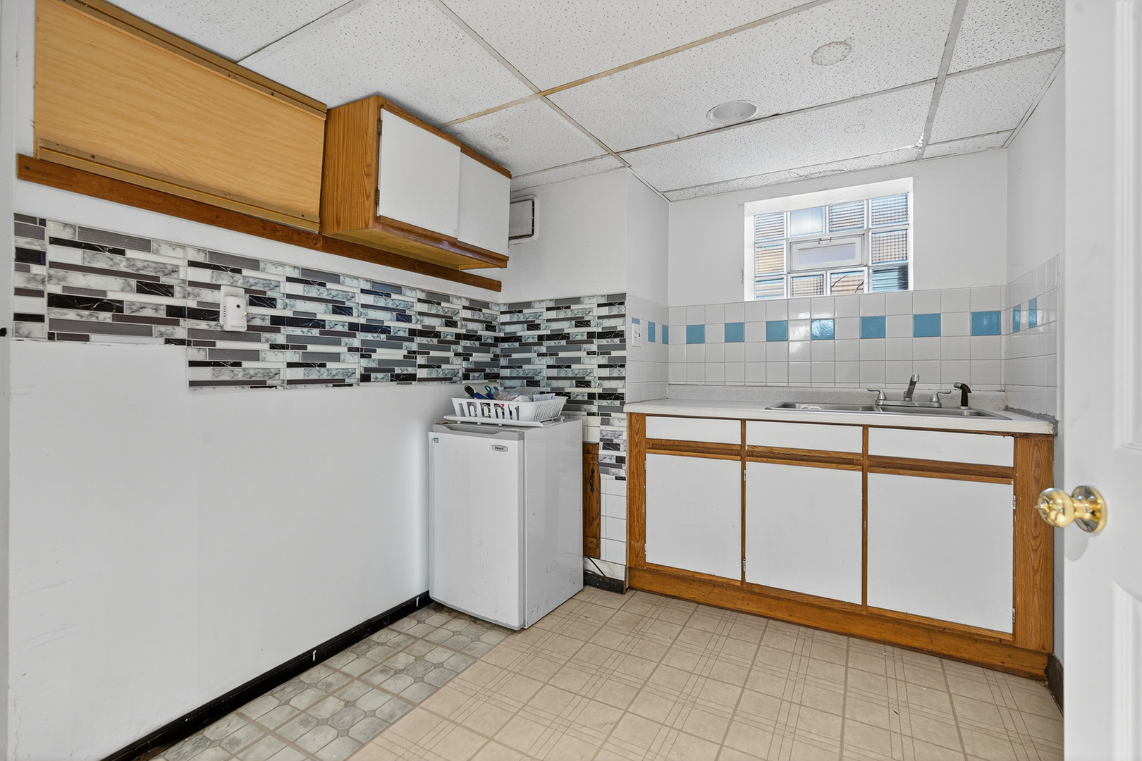 7346 57th Place Summit, IL 60501 - Photo 16 of 29 a kitchen with stainless steel appliances a sink and a refrigerator