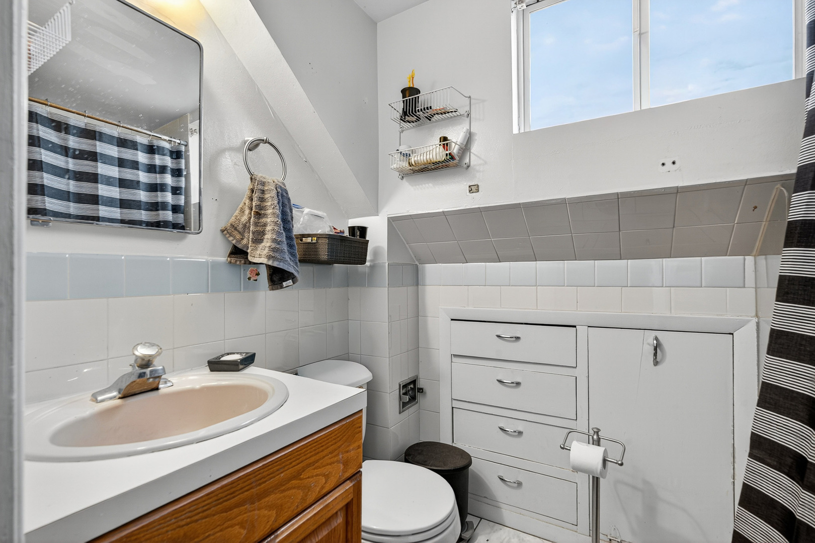 7346 57th Place Summit, IL 60501 - Photo 21 of 29 a bathroom with a sink a toilet and vanity