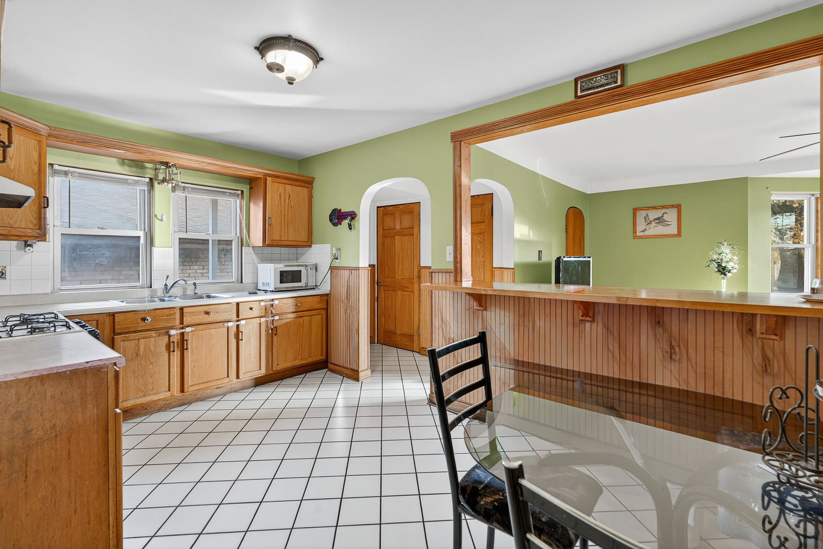 7346 57th Place Summit, IL 60501 - Photo 8 of 29 a kitchen with a sink cabinets and window