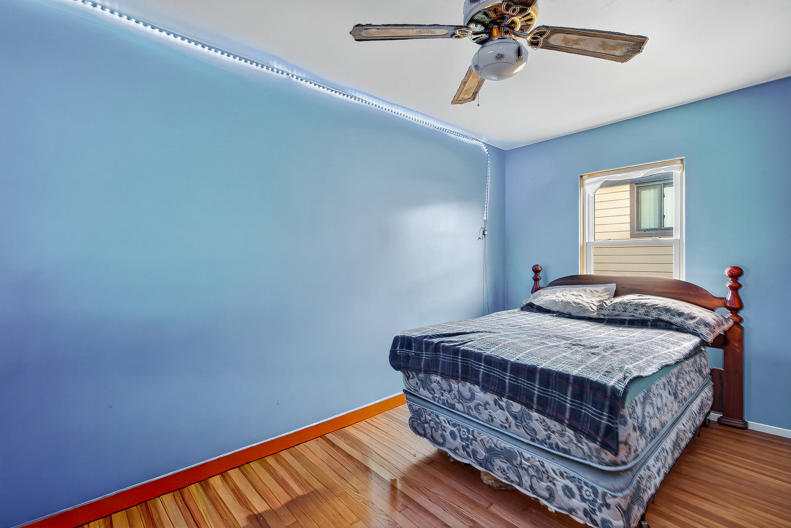 7346 57th Place Summit, IL 60501 - Photo 10 of 29 a bedroom with a bed and a chandelier