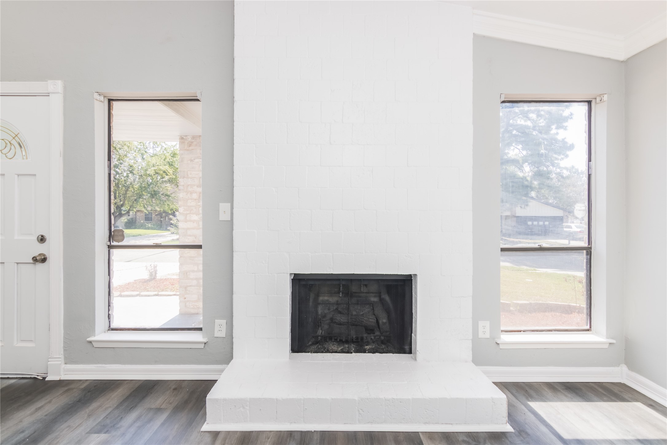 22914 Summer Pine Lane Spring, TX 77373 - Photo 3 of 19 a view of an empty room with wooden floor and a window