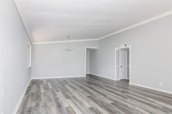 a view of room with wooden floor