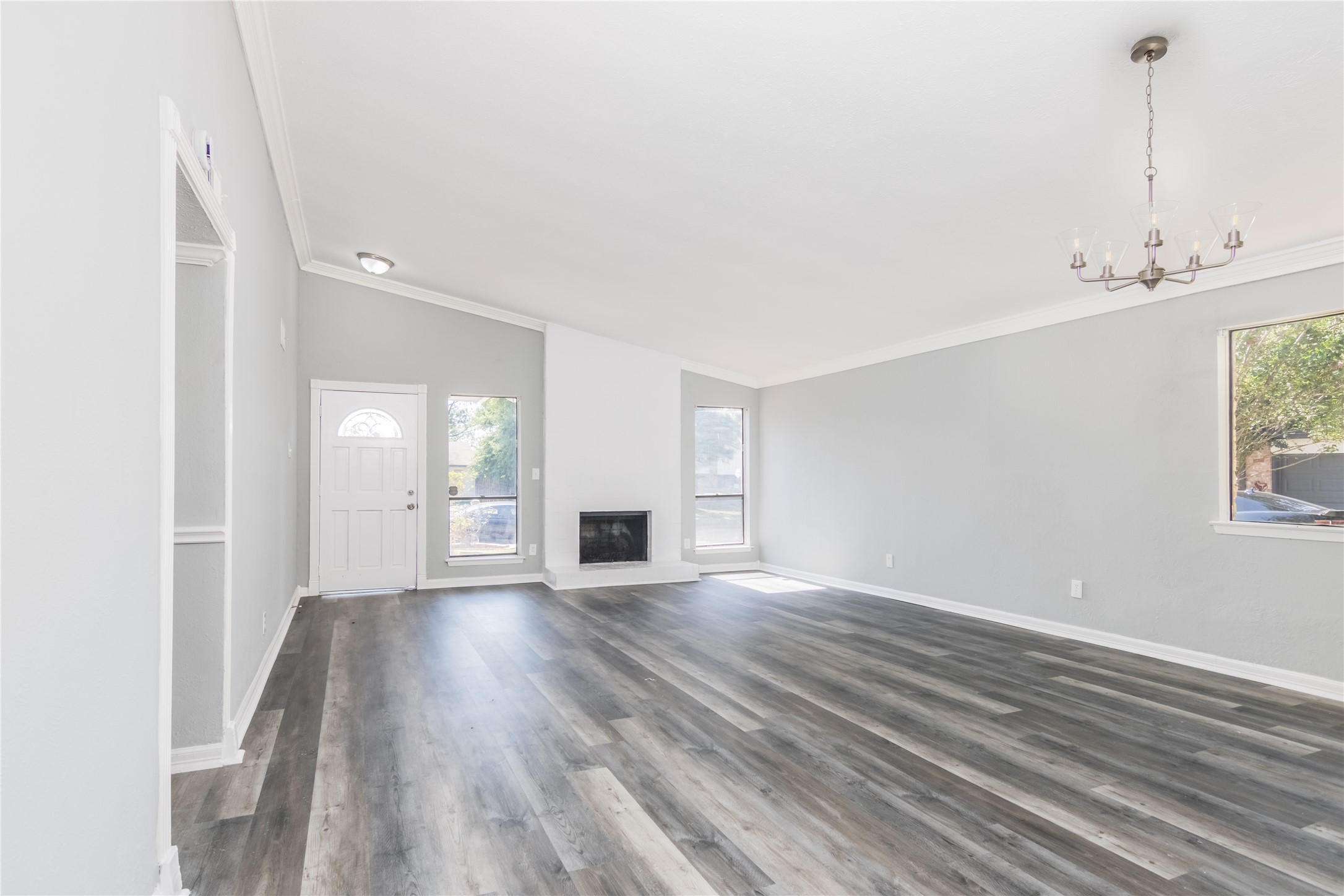 22914 Summer Pine Lane Spring, TX 77373 - Photo 5 of 19 a view of an empty room with wooden floor and a window