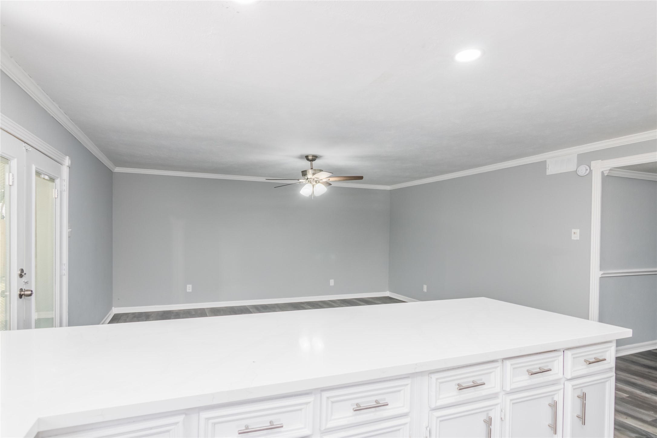 22914 Summer Pine Lane Spring, TX 77373 - Photo 8 of 19 a room with a white cabinet and a ceiling fan