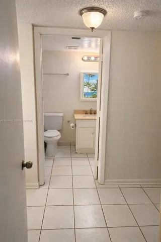 a bathroom with a toilet a sink and a shower