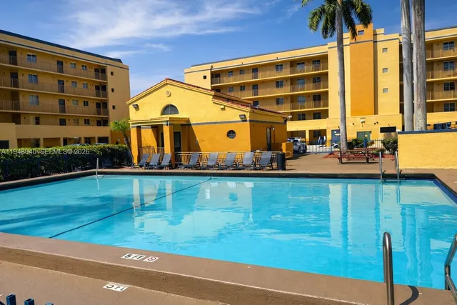 a view of a house with a swimming pool