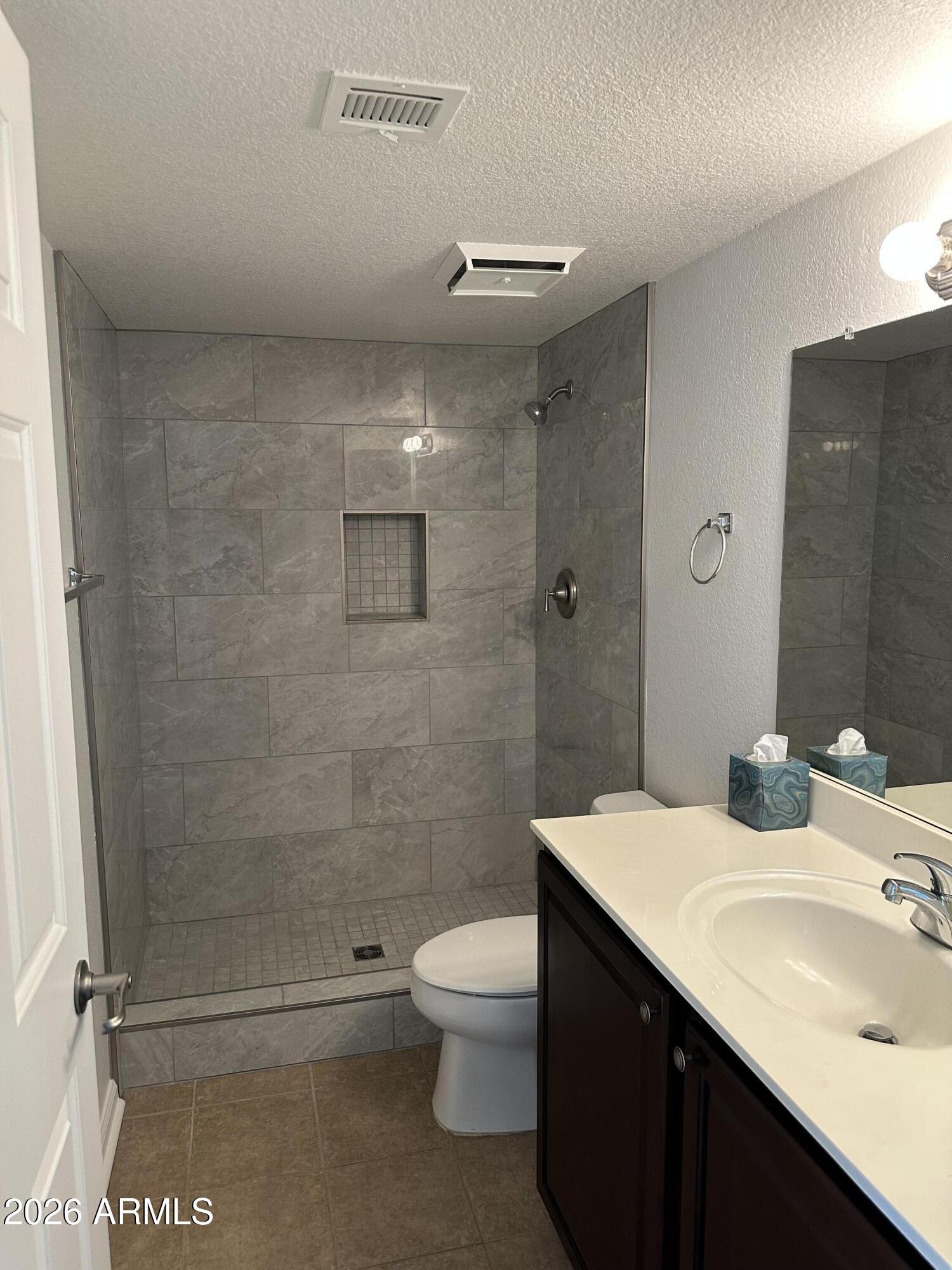 1720 East Thunderbird Road, Unit 1019 Phoenix, AZ 85022 - Photo 27 of 47 a bathroom with a sink a toilet and shower
