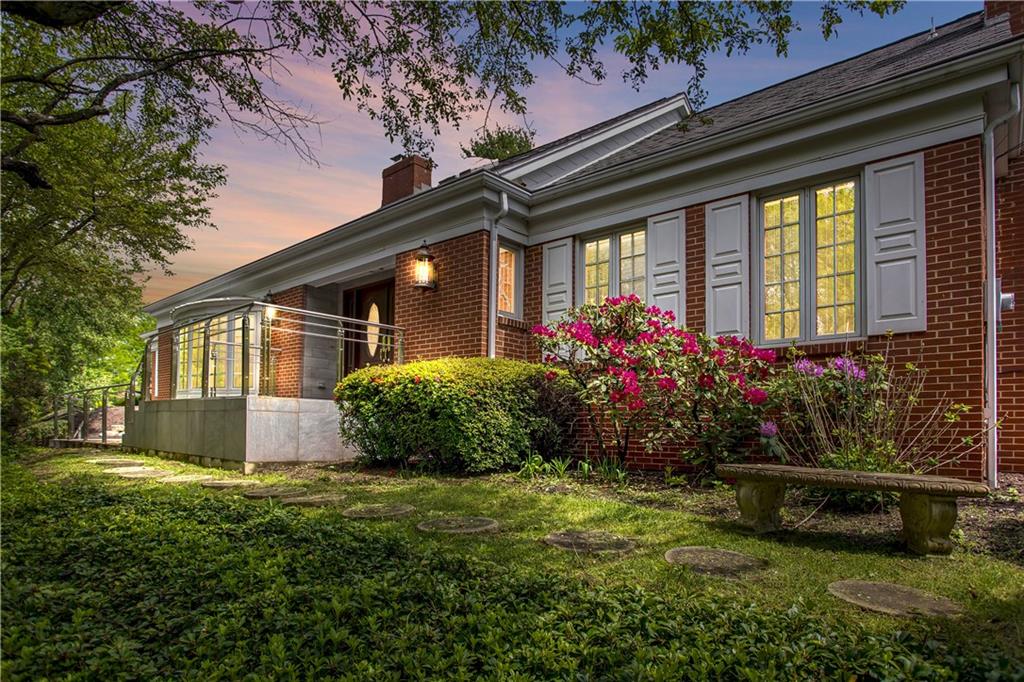 973 Osage Road Pittsburgh, PA 15243 - Photo 1 of 1 a front view of a house with a garden