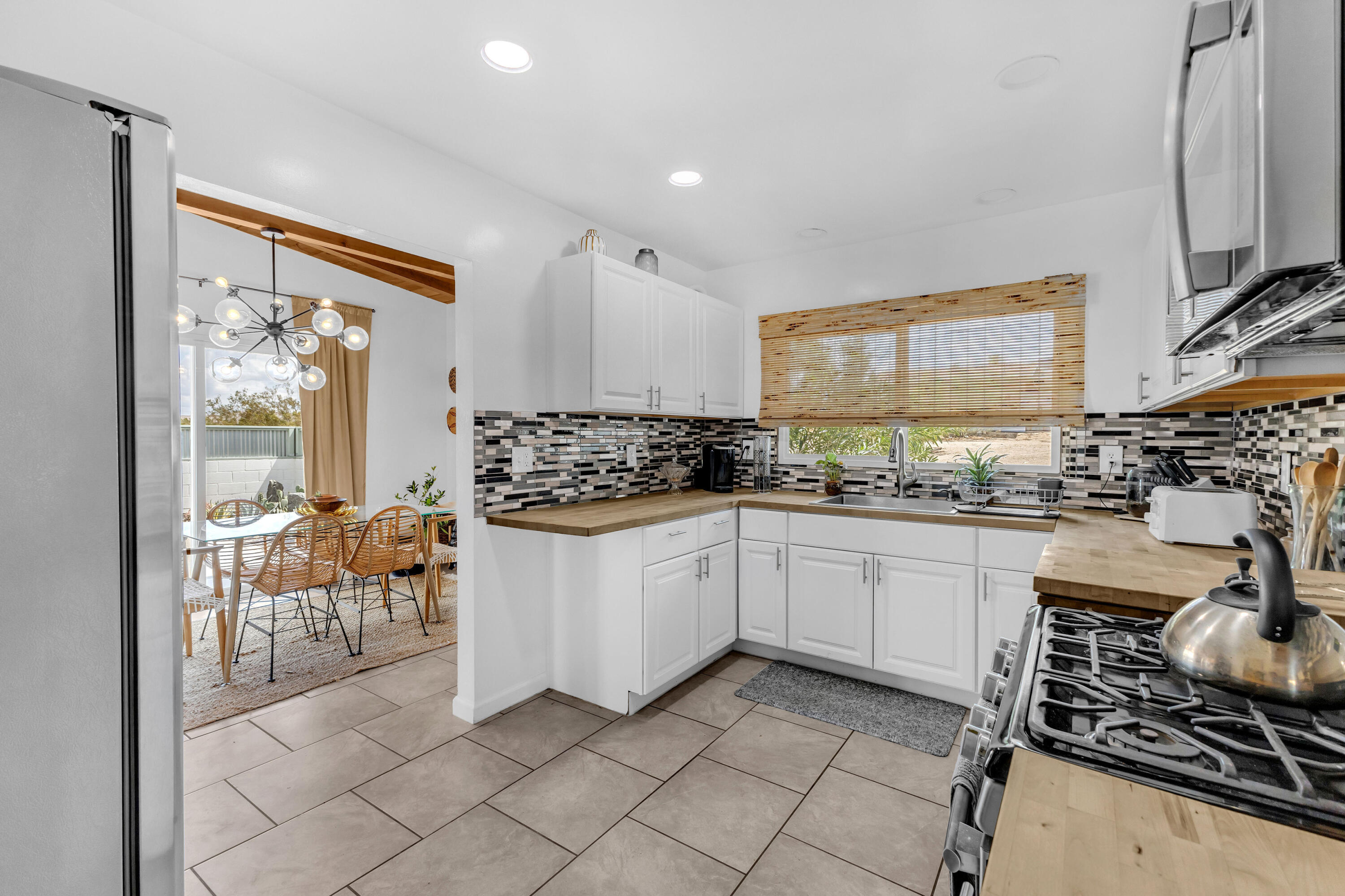 75047 Baseline Road Twentynine Palms, CA 92277 - Photo 13 of 47 a kitchen with a sink and a stove top oven