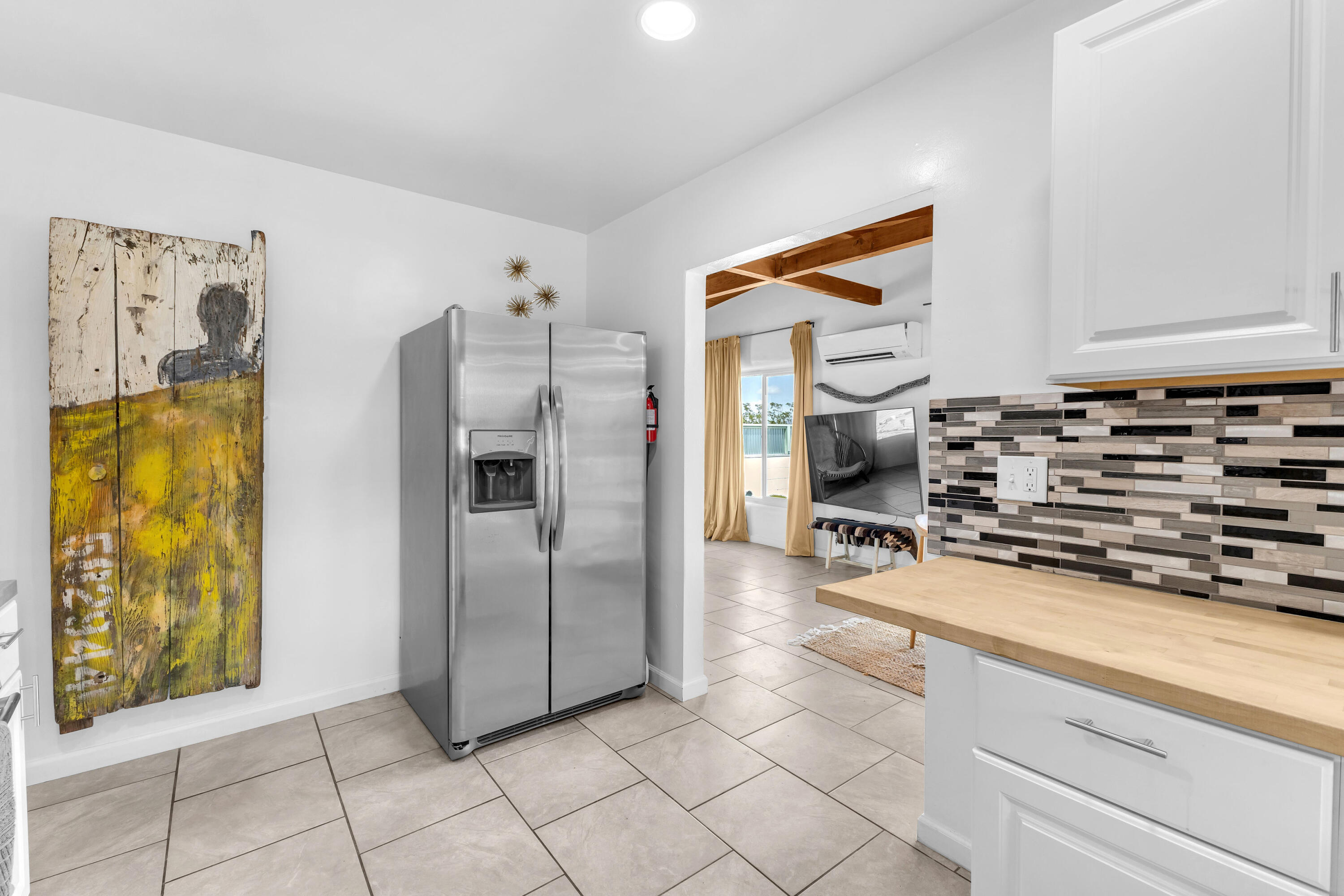 75047 Baseline Road Twentynine Palms, CA 92277 - Photo 17 of 47 a kitchen with stainless steel appliances a stove a refrigerator and cabinets