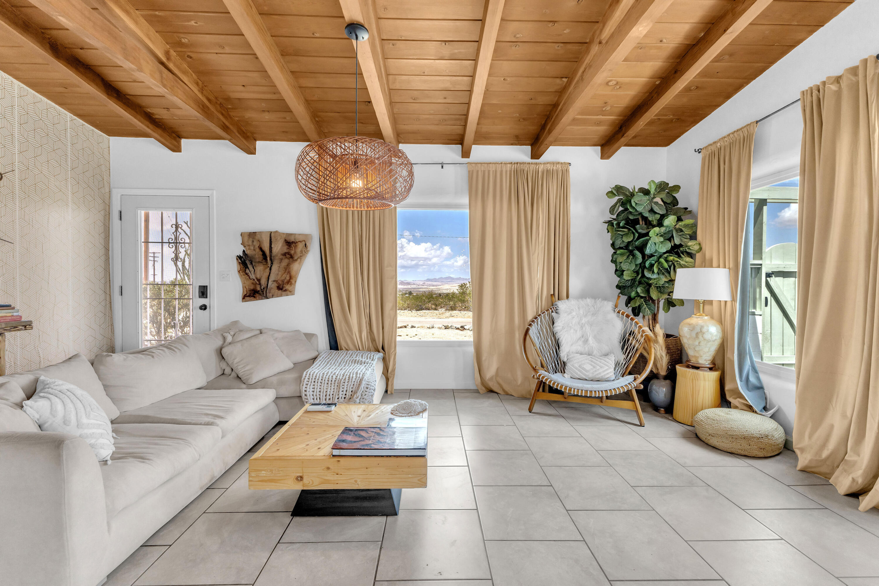 75047 Baseline Road Twentynine Palms, CA 92277 - Photo 21 of 47 a living room with furniture and a chandelier
