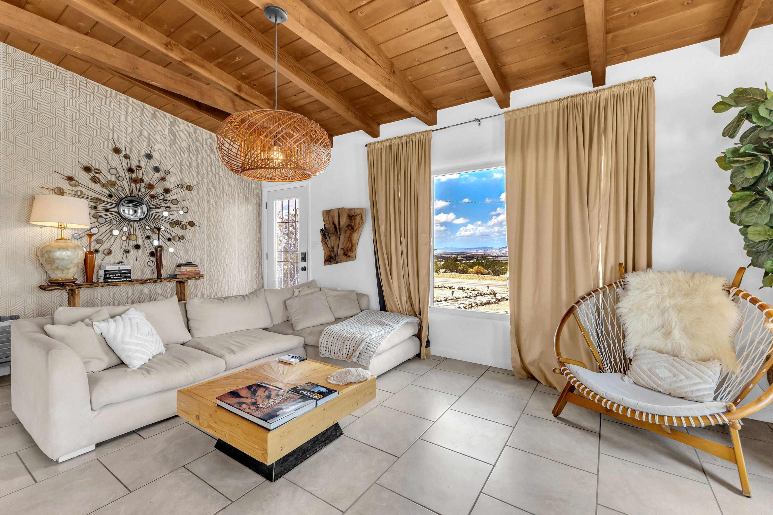 75047 Baseline Road Twentynine Palms, CA 92277 - Photo 22 of 47 a living room with furniture and a chandelier